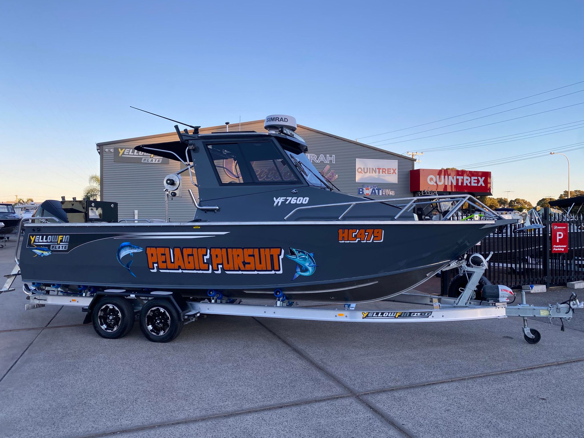 yellowfin cabin boat with a custom wrap