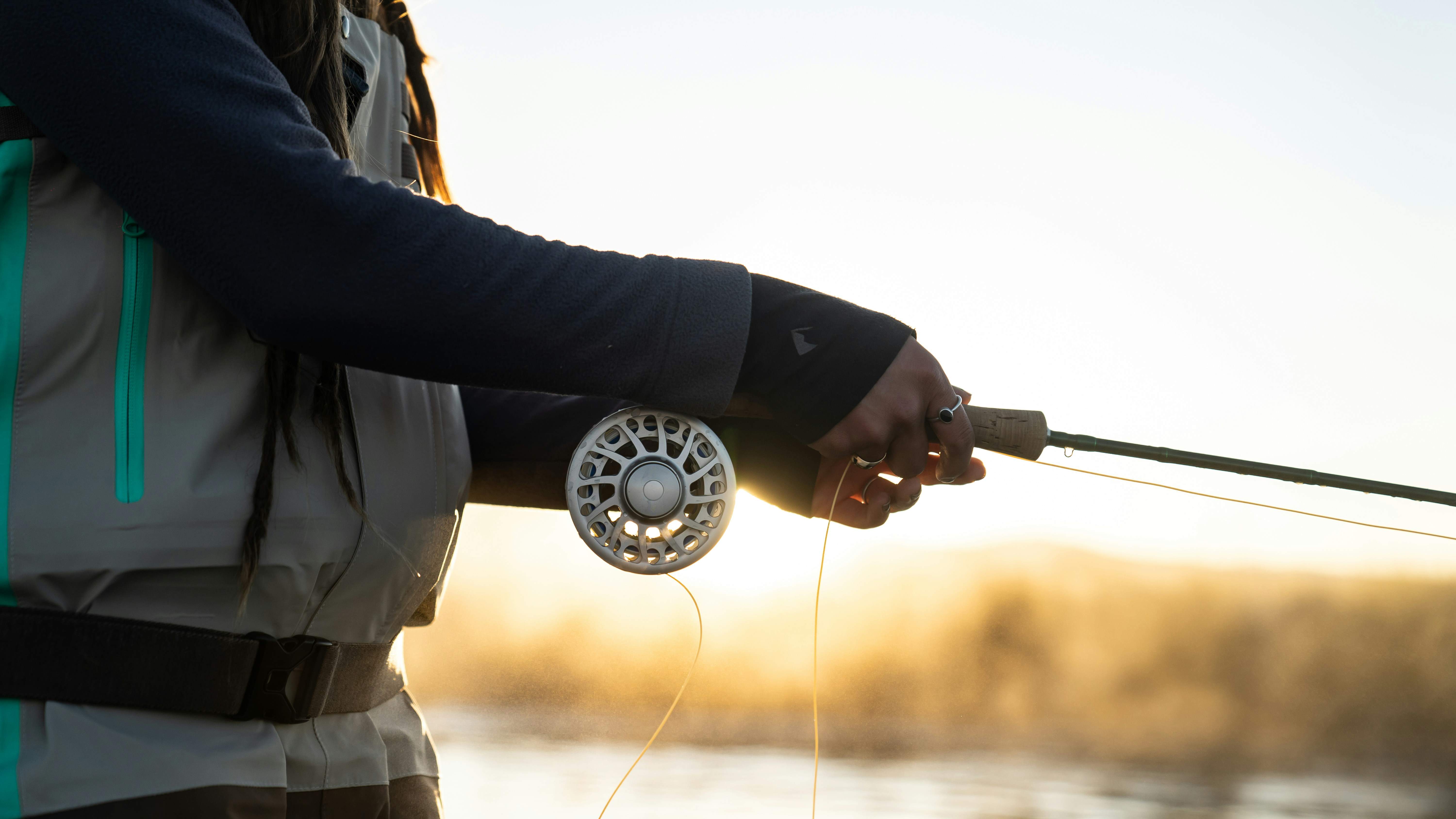 A person holding a fishing rod.