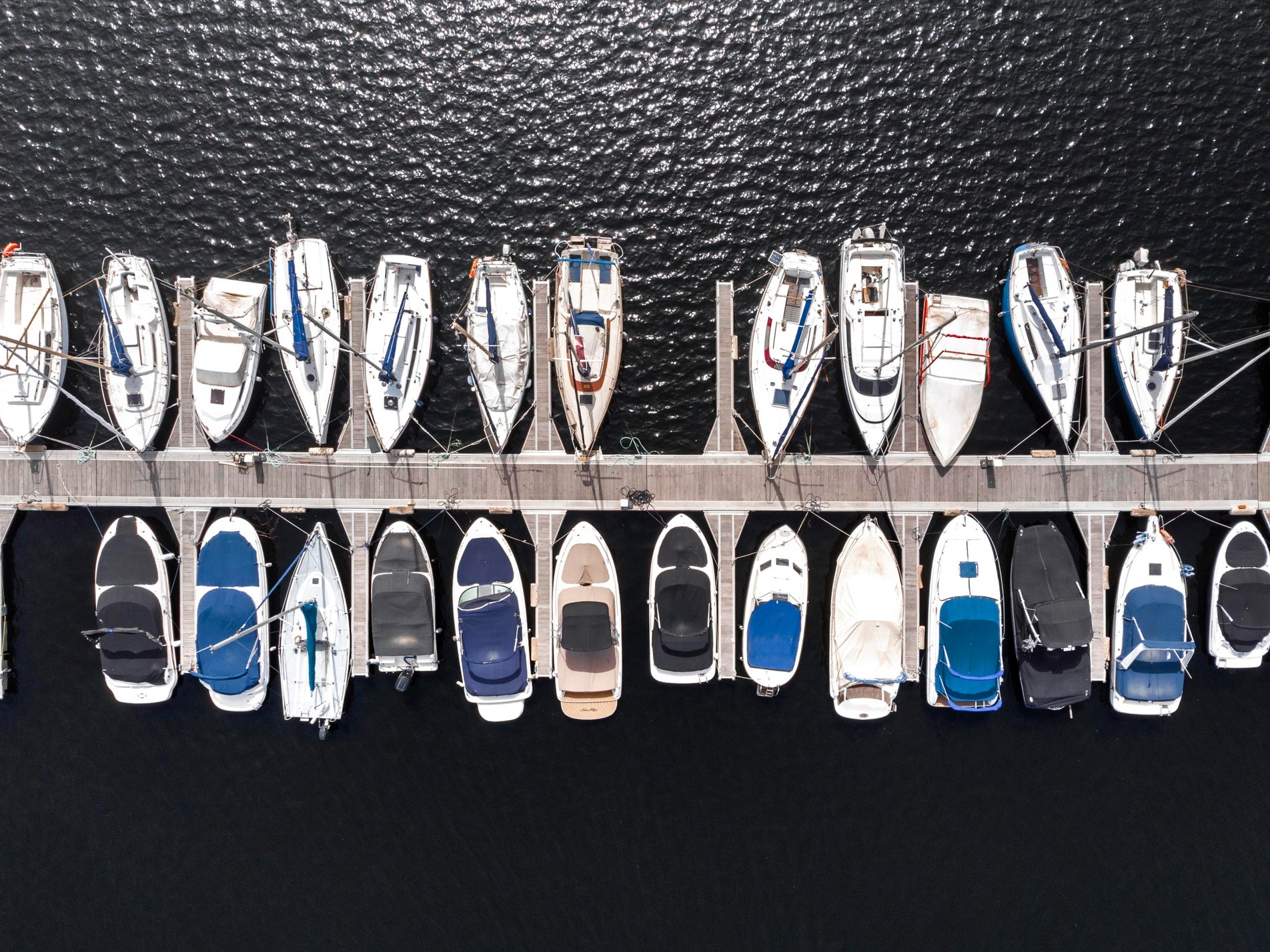 boat with cover moored in a slip