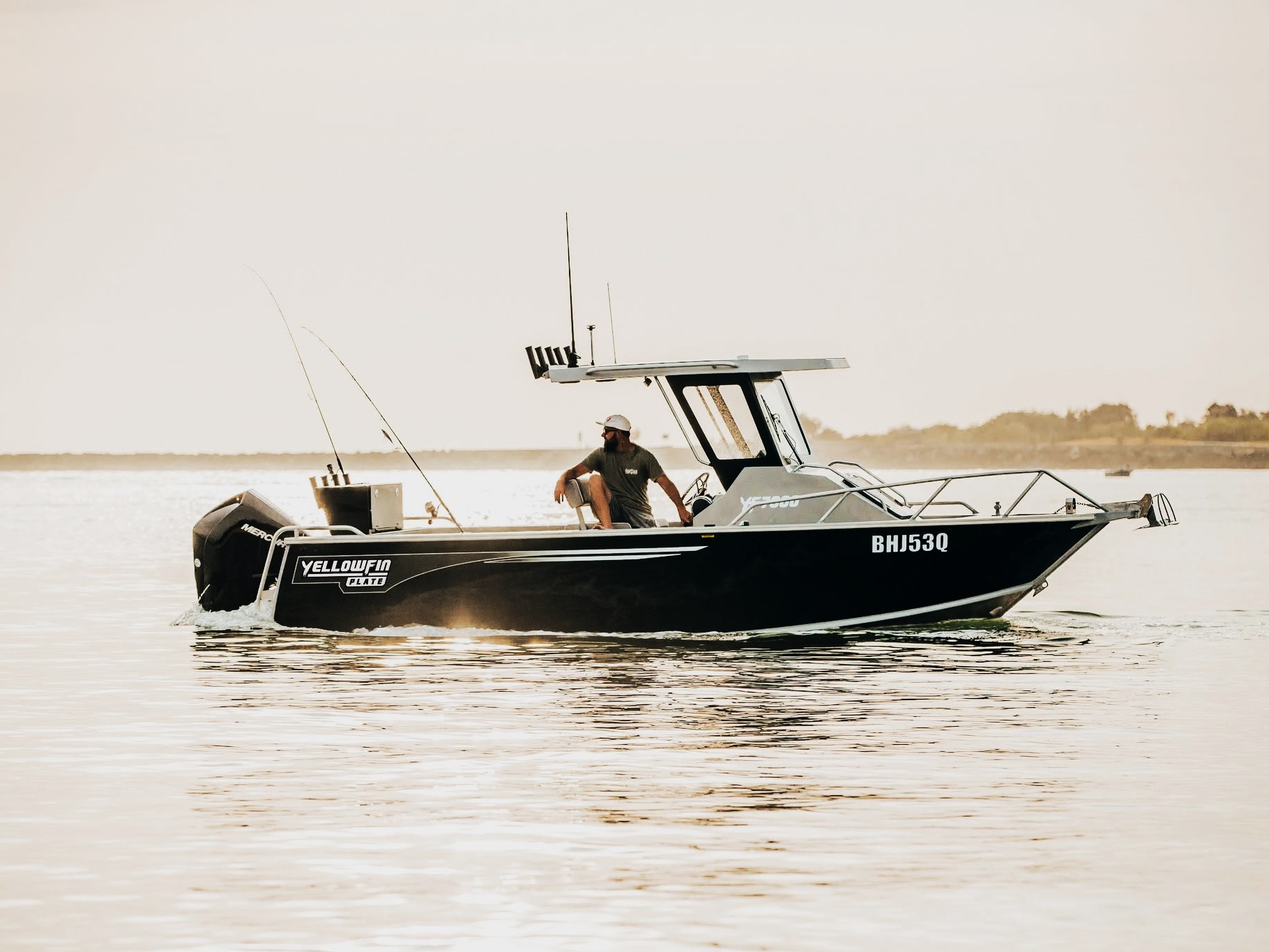 yellowfin centre cabin boat out on the water