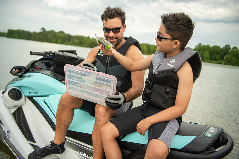 father and son duo on a yamaha waverunner, going fishing